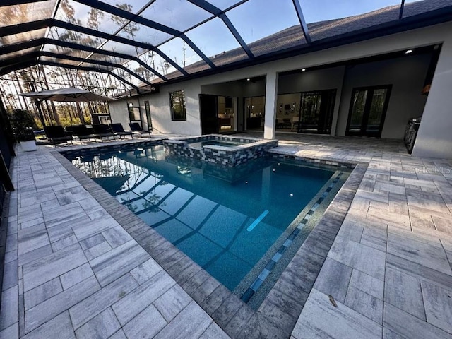 view of swimming pool with a lanai, an in ground hot tub, and a patio