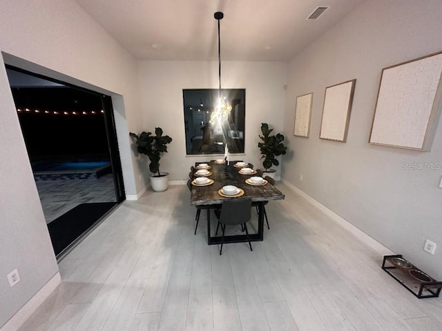 dining room with light hardwood / wood-style flooring