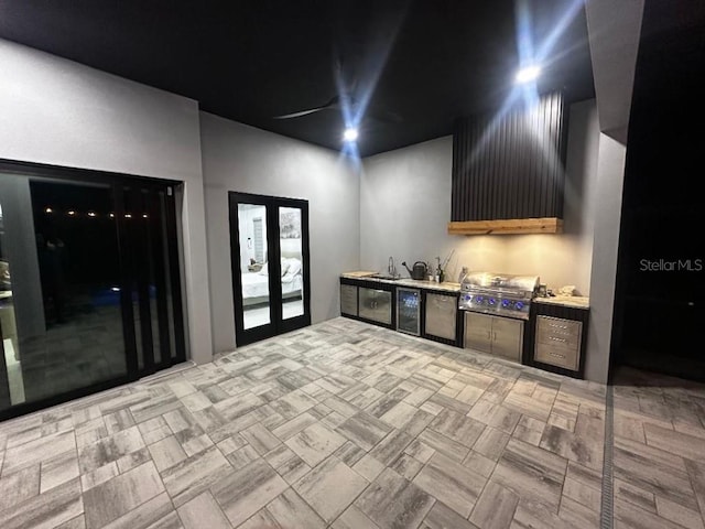 view of patio / terrace featuring an outdoor kitchen, grilling area, and french doors