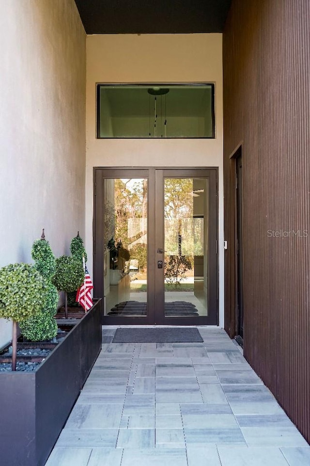 property entrance featuring french doors