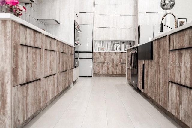 interior space featuring brown cabinetry, modern cabinets, and light countertops