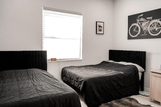 bedroom with light colored carpet