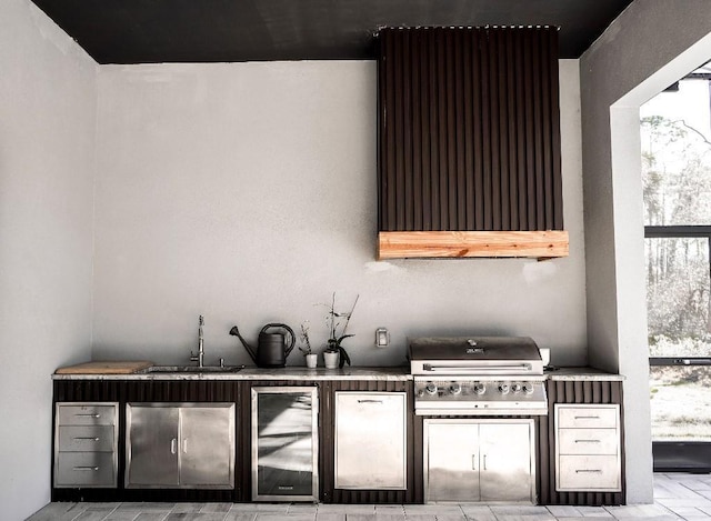 bar featuring range hood, beverage cooler, a sink, and under cabinet range hood