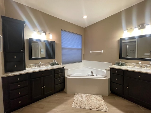 bathroom with a tub to relax in and vanity