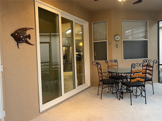 exterior space featuring ceiling fan