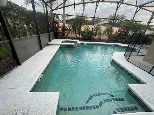 view of swimming pool featuring an in ground hot tub