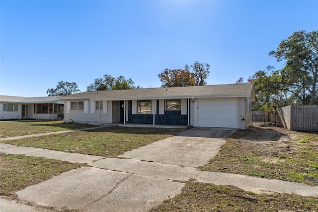 ranch-style house with a porch, a garage, and a front yard