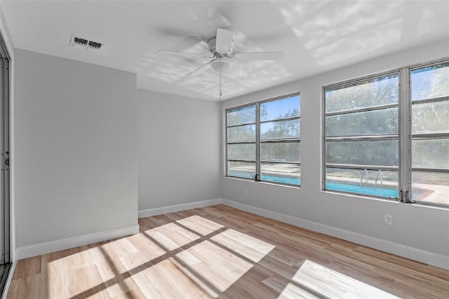 unfurnished room featuring ceiling fan and light hardwood / wood-style flooring