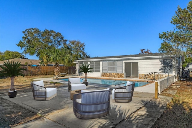 view of patio / terrace with a fenced in pool