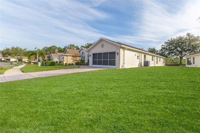 single story home with a front yard and central AC