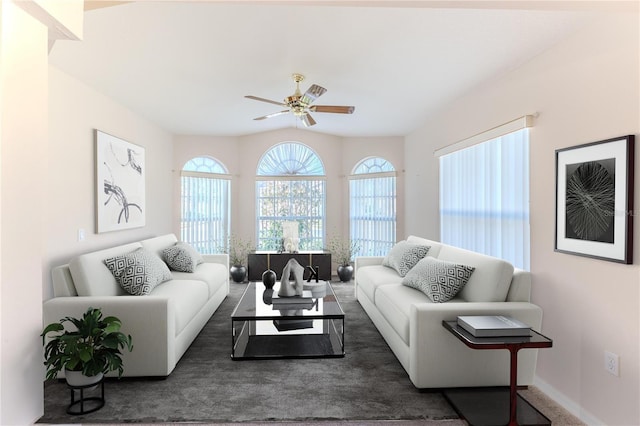 living room featuring dark carpet and ceiling fan