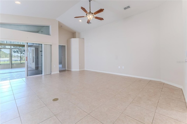 spare room featuring ceiling fan, light tile patterned flooring, and high vaulted ceiling