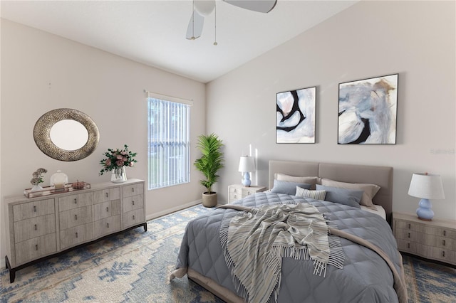 carpeted bedroom with ceiling fan and lofted ceiling