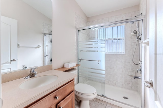 bathroom featuring tile patterned flooring, vanity, an enclosed shower, and vaulted ceiling