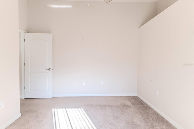 unfurnished room with light colored carpet