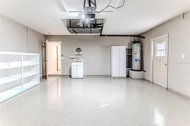 garage with electric water heater and sink