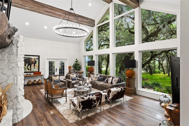 living room with french doors, high vaulted ceiling, and dark hardwood / wood-style floors