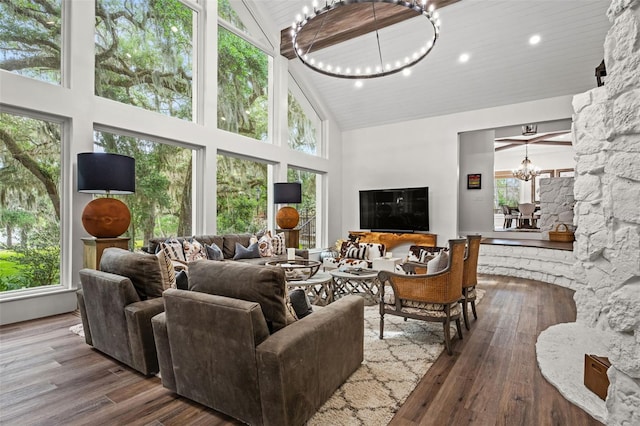 living room with a chandelier, hardwood / wood-style flooring, high vaulted ceiling, and wooden ceiling