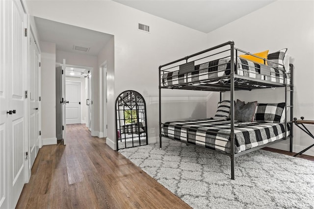 bedroom with a closet and wood-type flooring