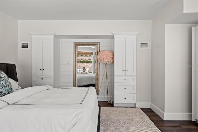 bedroom featuring dark wood-type flooring