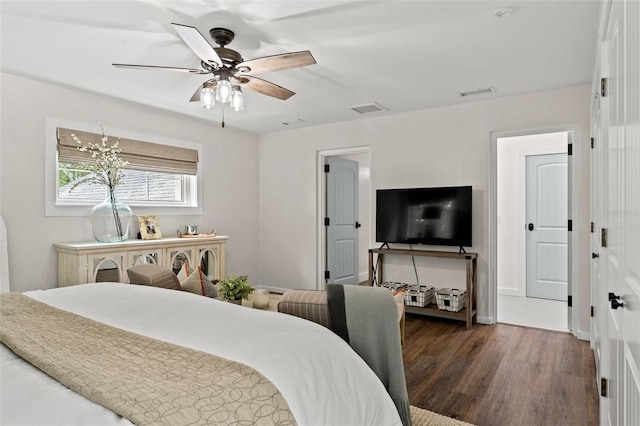 bedroom with ceiling fan and dark hardwood / wood-style floors