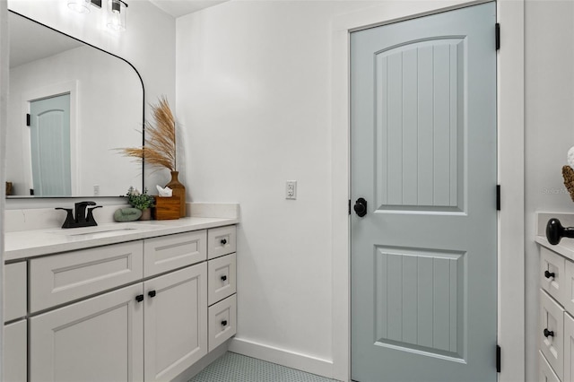 bathroom with tile patterned flooring and vanity