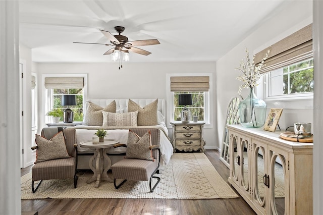 bedroom with ceiling fan and dark wood-type flooring