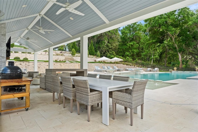 view of patio featuring pool water feature, ceiling fan, and a grill