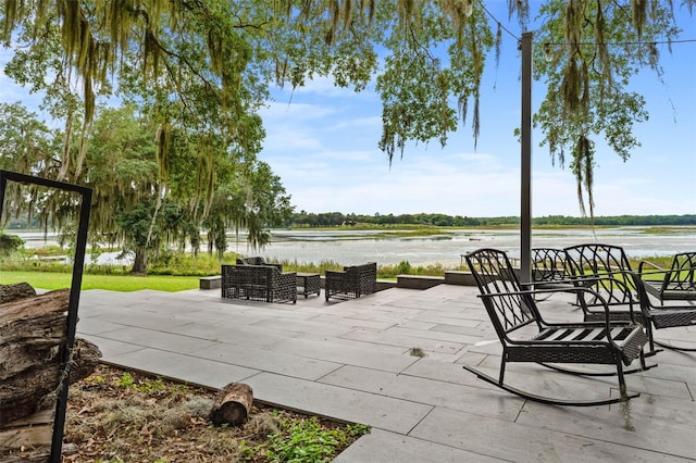 view of patio / terrace with an outdoor hangout area and a water view