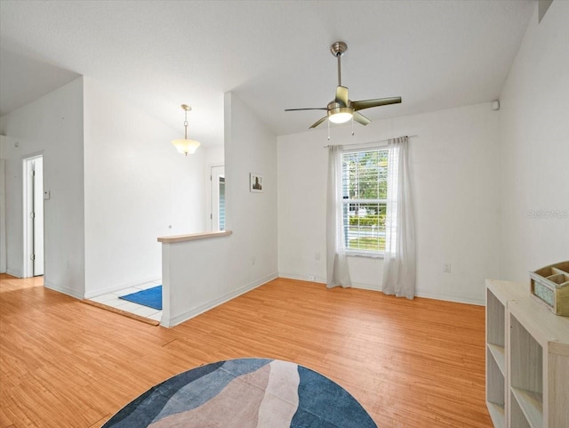 interior space with ceiling fan and light hardwood / wood-style flooring