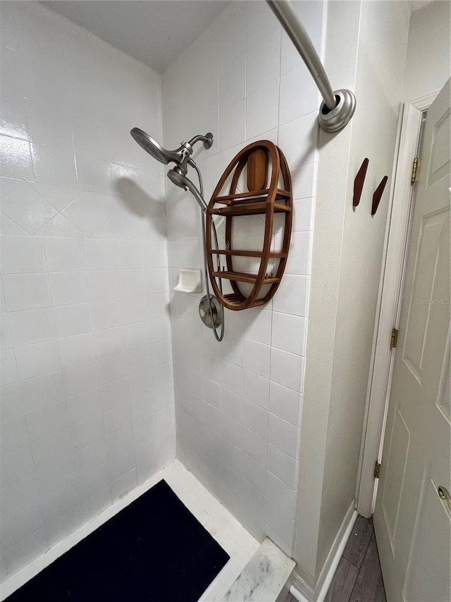 bathroom with a tile shower