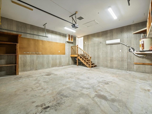 garage featuring a garage door opener and water heater