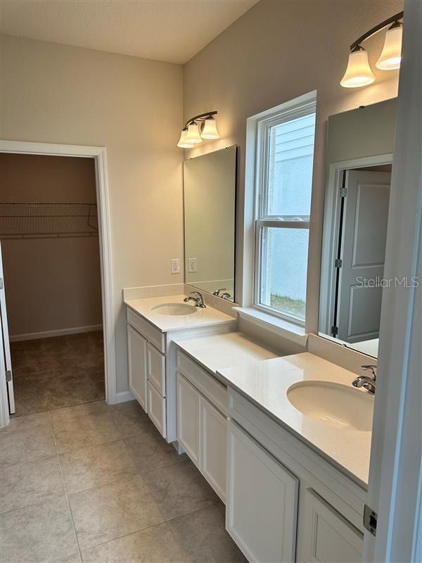 bathroom featuring vanity and tile patterned flooring