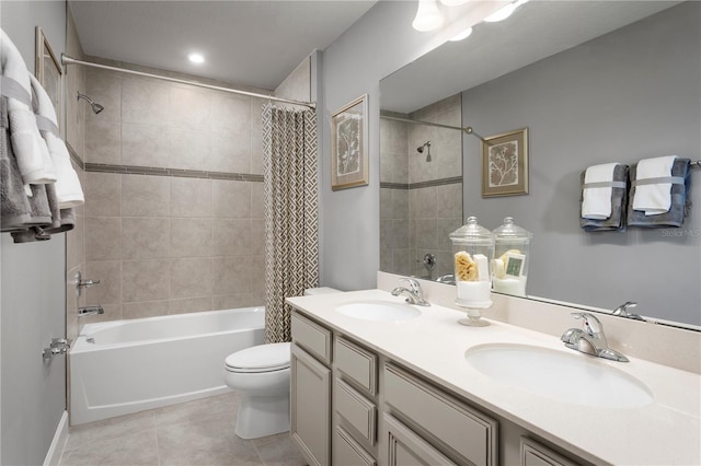 full bathroom featuring tile patterned flooring, vanity, shower / tub combo, and toilet