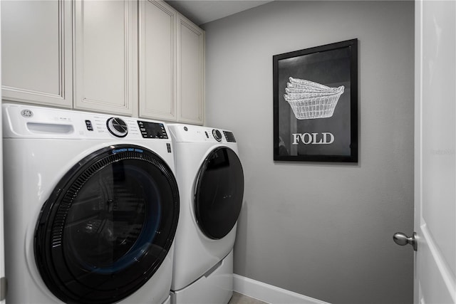 laundry area featuring cabinets and independent washer and dryer