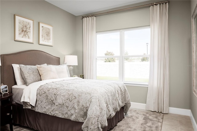 bedroom with light tile patterned flooring