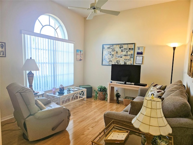 living room featuring hardwood / wood-style flooring and ceiling fan