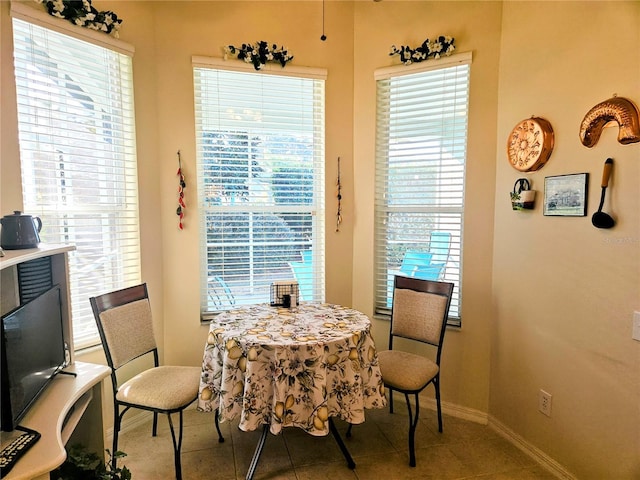 dining area featuring light tile patterned floors