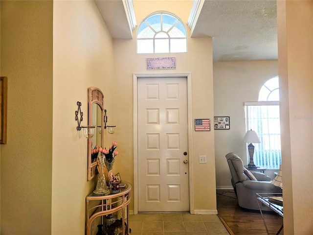 entryway featuring a textured ceiling