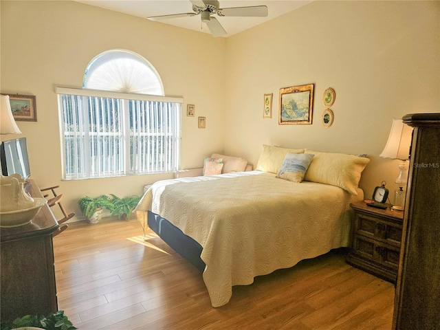 bedroom with light wood-type flooring and ceiling fan