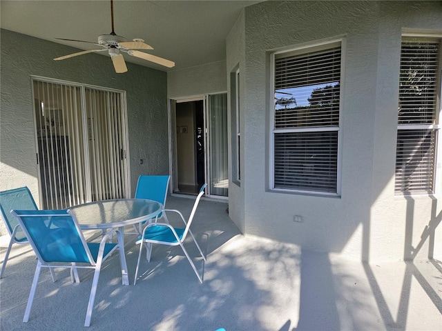 view of patio / terrace featuring ceiling fan