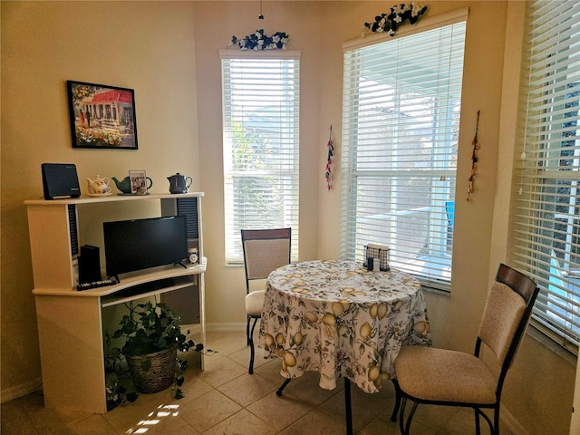 dining area featuring light tile patterned floors