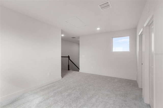 spare room with light colored carpet