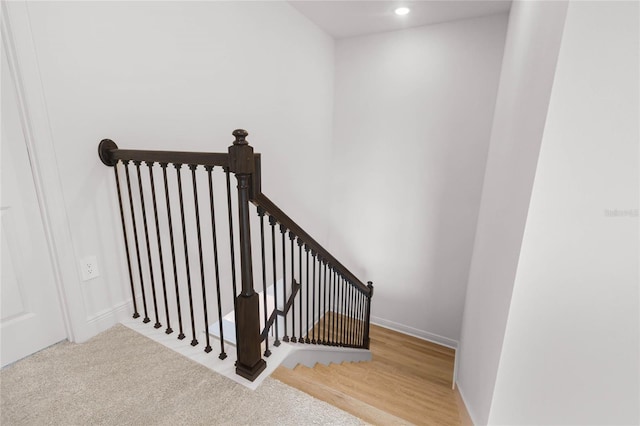 staircase with carpet floors