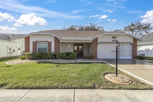 ranch-style home featuring a front yard and a garage