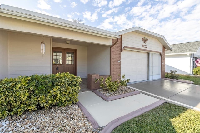 doorway to property featuring a garage