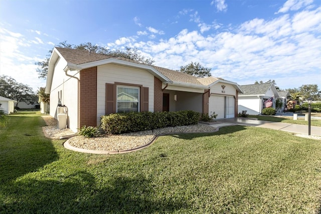 single story home featuring a garage and a front lawn