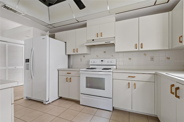 kitchen with visible vents, light countertops, white cabinets, white appliances, and under cabinet range hood