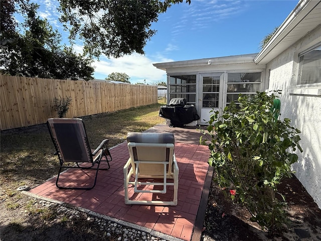 view of patio with a sunroom