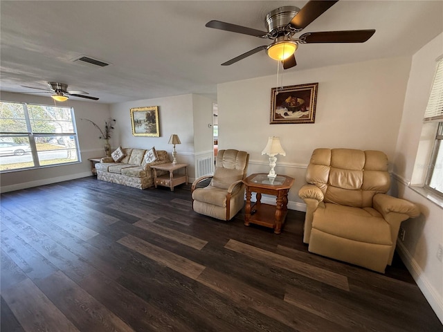 living room with ceiling fan and dark hardwood / wood-style flooring